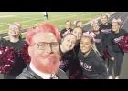 Jackson Heights Middle and High School Principal (second from left) debuted his new pink hair and beard at Friday’s JHHS football game. The new ‘do resulted from a fund-raising challenge to help JHHS alumna Skyler Mann, who is fighting brain cancer. Shown with Smith are JHHS cheerleaders (from left to right) Sabrina Streeter, Karma Carlson, Ava Rash, Nicole Amon, Dakota Bottom, Taylor Bosley, Alexis Deneault, Emirson Fritz and Makinley Mulroy. (Photo courtesy of Derek Smith)