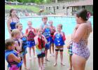 Spots for swim lessons at the Holton swimming pool have filled up fast this summer. Last week was the second session of group swim lessons at the pool. In the photo above, lifeguard Sydney Snyder (at right) is shown demonstrating how to hold onto a life jacket while students and lifeguard Abby Wellman (at left) look on.