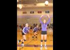Royal Valley's Ali Bryan (No. 3) sets the volleyball for hitters Grace Harvey (No. 26) and Danielle Stithem (No. 4) Tuesday night against ACCHS. 