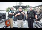 U.S. Senator Dr. Roger Marshall and five sheriffs from Kansas visited the southern border in Texas recently to discuss the immigration and drug crisis. Here, Sen. Marshall (at left) is shown with Jackson County Sheriff Tim Morse (center) and Shawnee County Sheriff Brian Hill (at right) on a heavily-armed boat on the Rio Grande with members of the Texas Department of Public Safety. (Submitted photo)