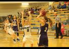 Holton sophomore Tabor Barta (No. 11 white jersey) defends McKenzie Ogden (No. 2 purple jersey) of Royal Valley in the game on last Tuesday. Other players in the photo are : N0. 14 Courtney Boswell for Holton (white jersey) as she defends No. 13 Bella Thompson (purple jersey).